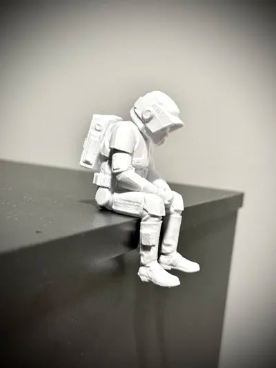Sad Scout Trooper sitting on a ledge Figurine!