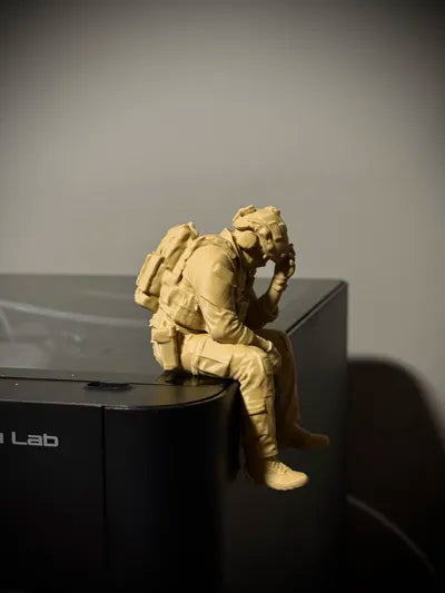 Sad Soldier sitting on a ledge Figurine!