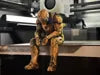 Sad Iron Man Figurine sitting on a ledge!